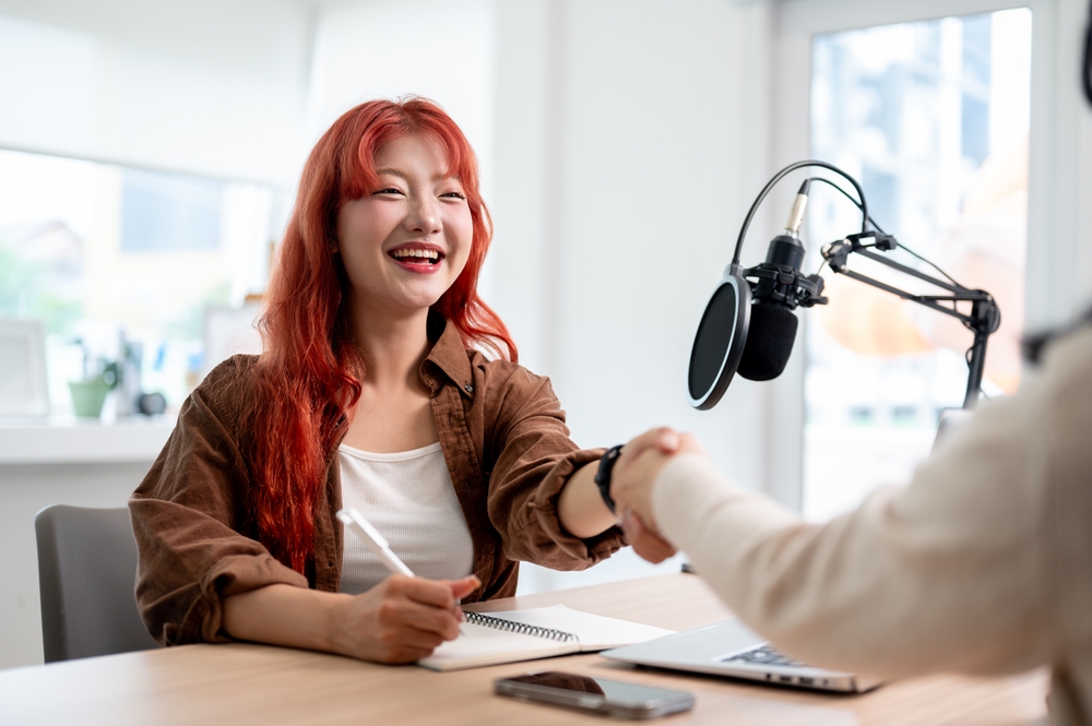 Asian Podcaster in the studio